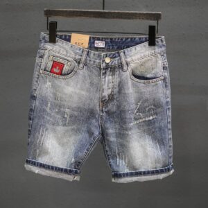 Pantalones vaqueros cortos rotos de estilo retro con bajo deshilachado